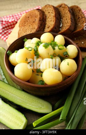 Concept of tasty food with boiled young potatoes, isolated on white ...