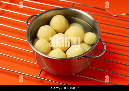 Concept of cooking with boiled young potatoes Stock Photo - Alamy