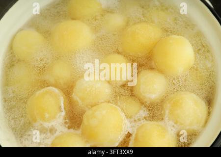 Concept of cooking with boiled young potatoes Stock Photo - Alamy