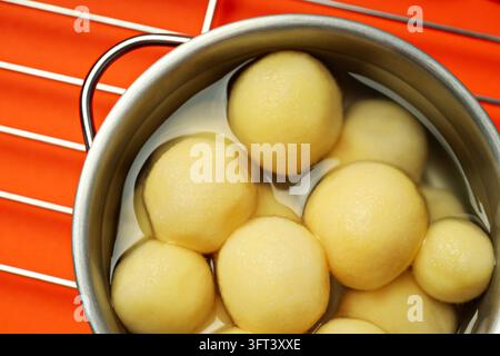 Concept of cooking with boiled young potatoes Stock Photo - Alamy