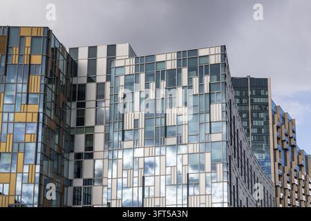 Exterior view of contemporary office towers with geometric pattern glass facade Stock Photo