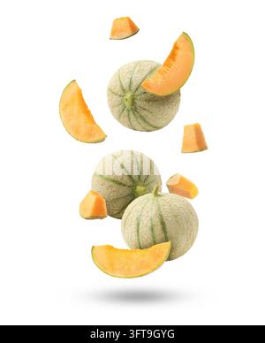 Fresh cantaloupe melons falling on white background. Whole and sliced Stock Photo
