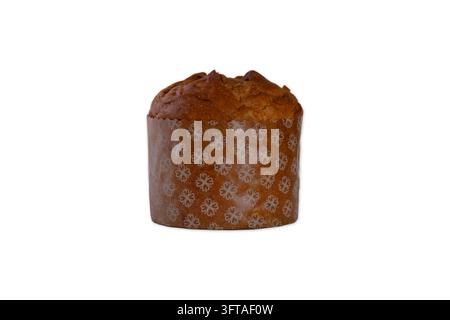 A whole traditional Italian panettone sweet bread cake, freshly baked to a golden brown crust, resting inside a cylindrical brown paper baking mold de Stock Photo