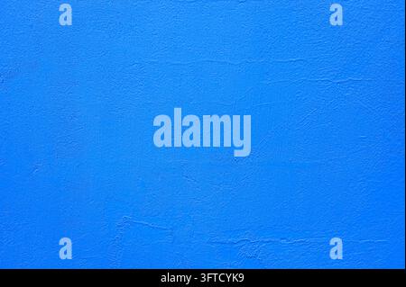 Bright smooth blue wall as texture or background Stock Photo