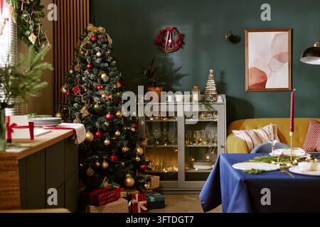 Decorated Christmas Tree Standing in Modern Living Room Stock Photo