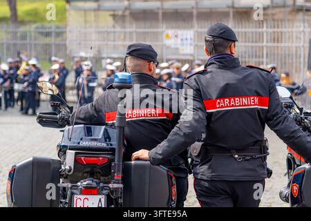 Police officers stand beside military vehicles on a street in Marseille ...