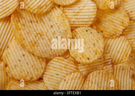 Lots of potato chips, texture close up Stock Photo