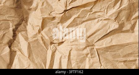 Brown texture kraft paper, recycled cardstock. Old crumpled recycled paper close-up of old crumpled recycled paper Stock Photo