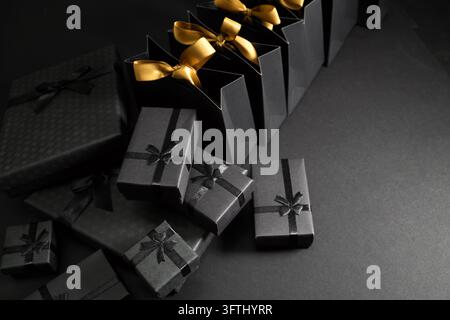 Black Friday. Black gift boxes and shopping bags for luxury gifting Stock Photo
