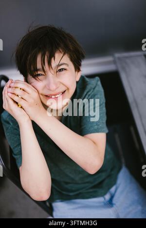 High angle view of a happy boy smiling at the camera Stock Photo