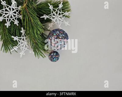 Christmas Flat Lay with Handmade Crochet Snowflakes and Colorful Decorative Balls Stock Photo