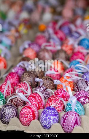 Decorated Easter eggs in egg cartons displaying vibrant colors and intricate patterns Stock Photo