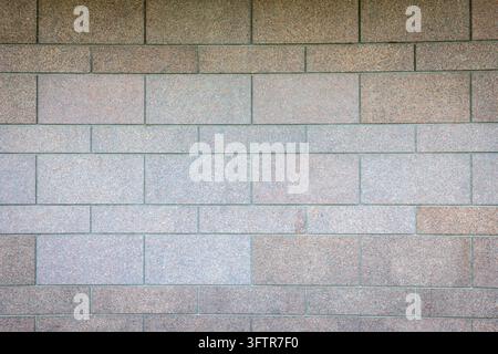Modern Brown and Grey Granite Tiled Stone Wall Texture Background Stock Photo