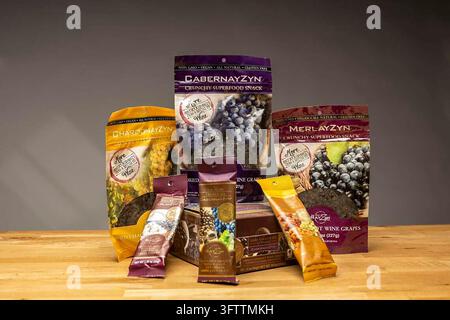 Packages of wine grape raisins made by the Wine RayZyn Company are displayed on September 29, 2026. The product line includes plain Cabernet, Merlot and Chardonnay raisin varieties, as well as dark chocolate, Greek yogurt and sea salt caramel-covered options, all marketed as non-GMO, vegan, all-natural and gluten-free crunchy superfood snacks. (Photo by Hector Amezcua/Sacramento Bee/TNS/Sipa USA) Stock Photo