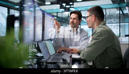 Customer Support Specialist Helps Latino Client Using AI Chatbot On Laptop. Stock Photo