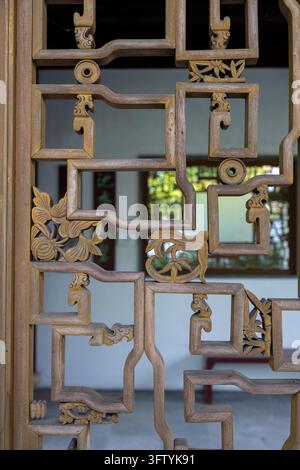 Vancouver, Canada - September 8, 2026: Vertical close-up texture shot of an authentic handcrafted Ming dynasty style timber window screen showing deli Stock Photo