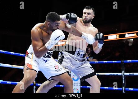Solomon Dacres (left) during his Heavyweight bout against Bakhodir ...