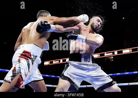 Daniel Dubois (left) lands a punch on Fabio Wardley during their ...