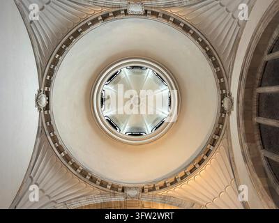 Stunning low angle shot of historic marble dome showing intricate fan patterns, central circular skylight, and neoclassical structural elements Stock Photo
