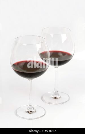 Glasses of red wine on white background Stock Photo