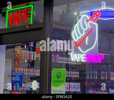 Colourful neon vape shop window advertises electronic cigarettes and vaping products in Lord Street, Fleetwood. Stock Photo