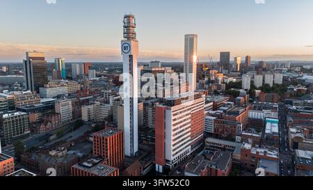Panoramic aerial drone view of the iconic BT Tower and city skyline at golden hour in Birmingham, England Stock Photo