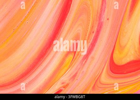 Vibrant abstract fluid art background featuring smooth swirls warm orange, yellow, and red paint Stock Photo