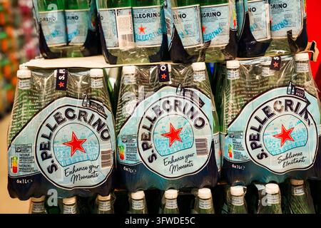 RIGA, LATVIA. 12th March 2026. Plastic shrink-wrapped six-packs of San Pellegrino sparkling mineral water displayed on store pallets in Riga, Latvia. Stock Photo