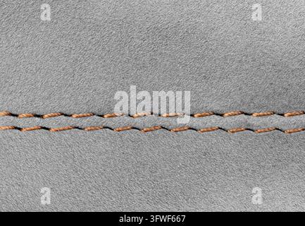 Macro shot of premium Gray suede material showing natural soft grain and professional seam. High-quality detail of footwear or luxury accessory surfac Stock Photo