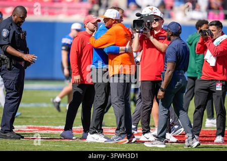 Running Headline Example SMU head coach Rhett Lashlee, center front, stands with his team before ...
