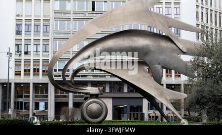 Milan, Italy - March 2 2026: Monumento al Carabiniere by sculptor Luciano Minguzzi, an abstract steel flame honoring fallen carabinieri, in front of a Stock Photo