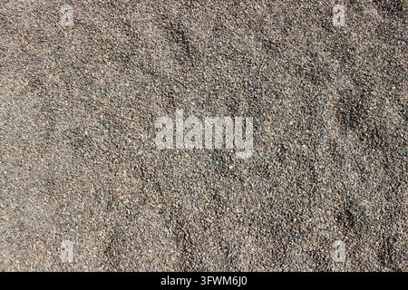 Full frame overhead texture background of fine grey and brown gravel pebbles Stock Photo