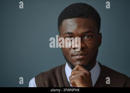 Portrait of Thoughtful Black Male Teacher Looking at Camera Stock Photo