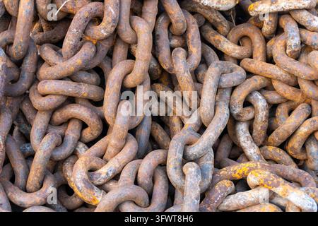 Pile of old rusty industrial chains close up texture Stock Photo