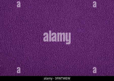 Purple Abstract Artificial texture fur fabric, background, close up. Fluffy material background, children's toys faux fur Stock Photo