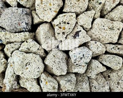Close up of lightweight concrete blocks showcasing their porous texture, ideal for construction and landscaping projects Stock Photo