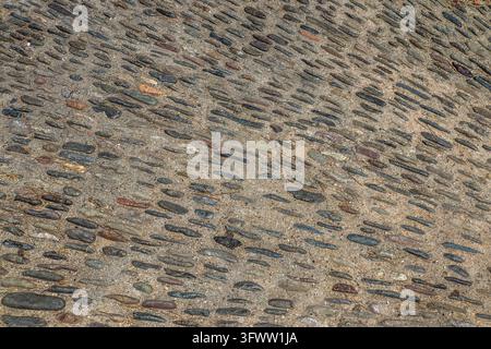 Close up view of a cobblestone pavement creating a beautiful textured surface Stock Photo