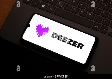 In this photo illustration, the Deezer logo is seen displayed on a ...