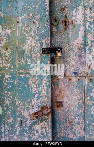 Close view of a turquoise painted surface showing dark vertical streaks ...