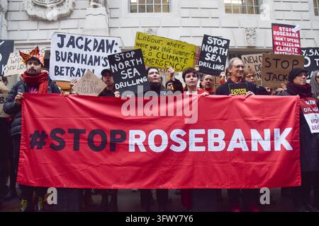 Protest Against Fosil London, UK. 21st October 2026. Activists from the climate action group ...