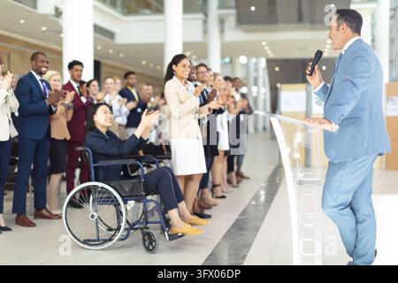 Side view of mature Caucasian businessman doing a speech in conference room Stock Photo