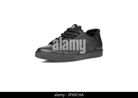 black leather sneakers on a white background close-up Stock Photo