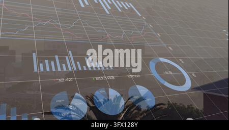 Displaying translucent financial dashboard projecting bar and line charts from rooftop, with grid Stock Photo