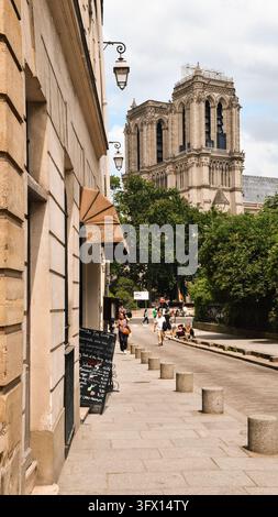 View of Notre-Dame Cathedral from Rue Saint-Julien-le-Pauvre in Paris, France Stock Photo