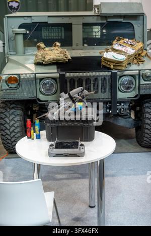 A drone and medical equipment displayed in front of a military Humvee at Future Forces Forum 2026 defense exhibition. Stock Photo