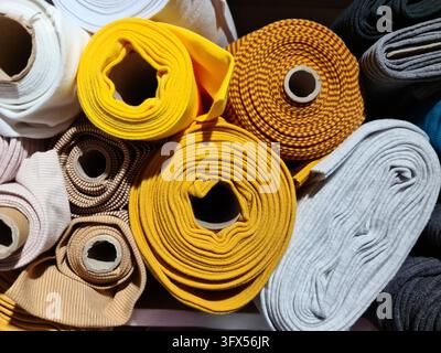 Samples of cloth and fabrics in different colors found at a fabrics market Stock Photo