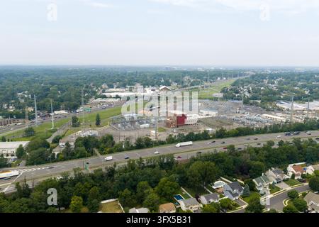 Aerial view of industrial electrical substation and highway Stock Photo