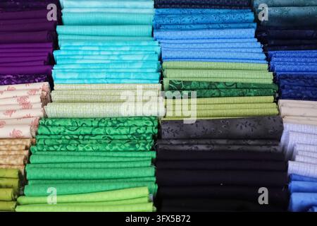 Samples of cloth and fabrics in different colors found at a fabrics market Stock Photo