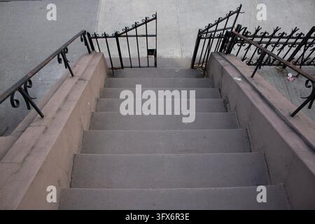 Stone stairs from below with fence Stock Photo