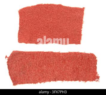 Red fabric swatches on clean white background. Textured material displays subtle weave pattern. Slightly frayed edges enhance rustic appeal. Ideal for Stock Photo